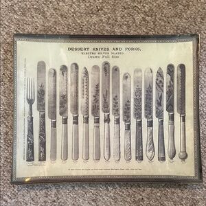 Vintage tray depicting dessert, knives, and forks of the early 1900s